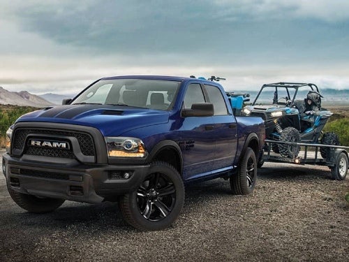 2024 RAM 1500 Classic towing a side-by-side