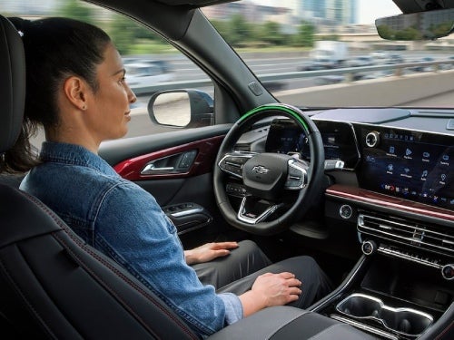 2024 Chevrolet Traverse view of woman in driver seat with hands off of wheel