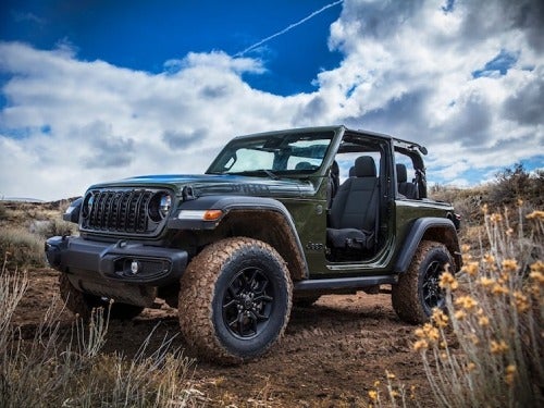 2024 Jeep Wrangler mudriding with doors and roof off