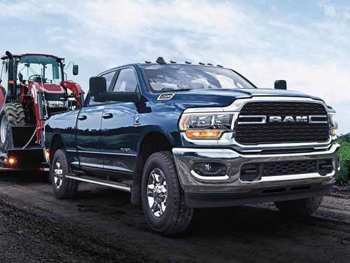 2023 RAM 2500 towing a tractor