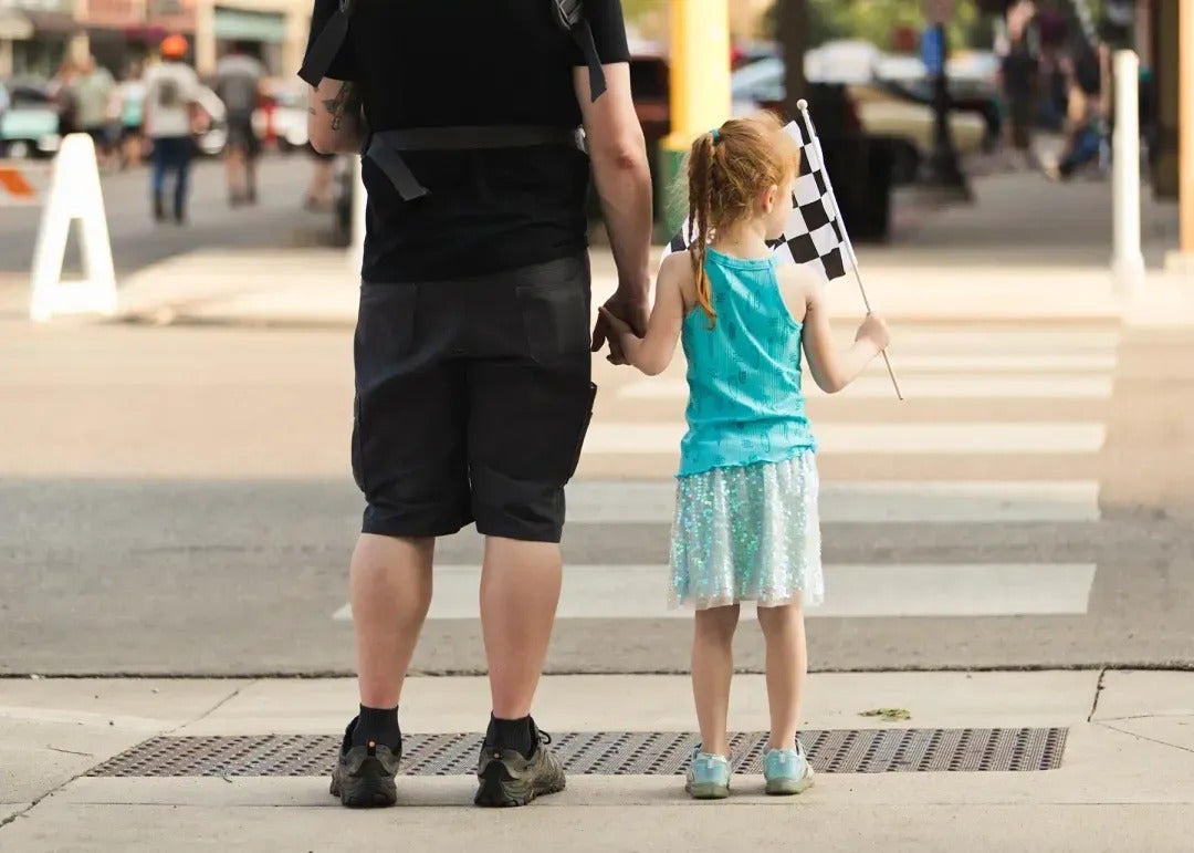 Father and daughter holding hands