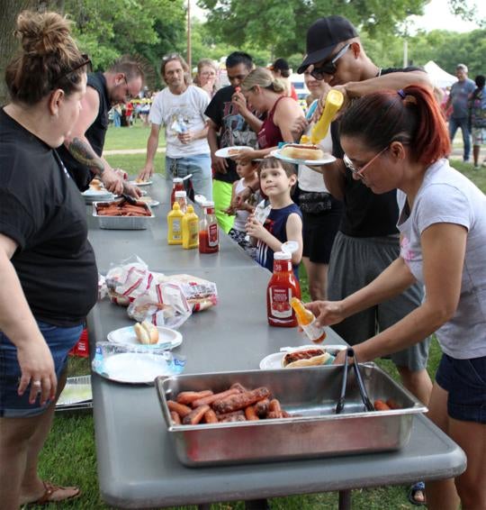 Faribault residents enjoying food at the Safe Summer Kickoff