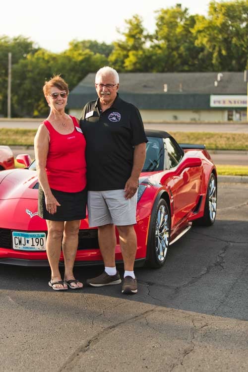 Couple with their Corvette