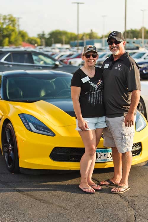 Couple with their Corvette
