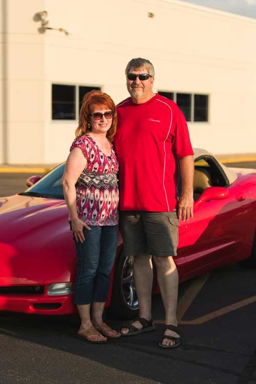 Couple with their Corvette