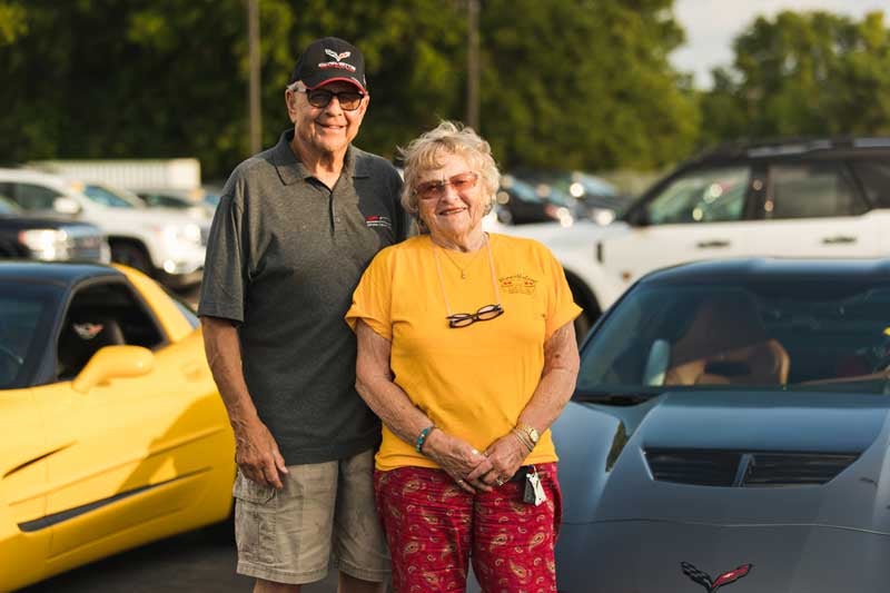 Couple with their Corvette